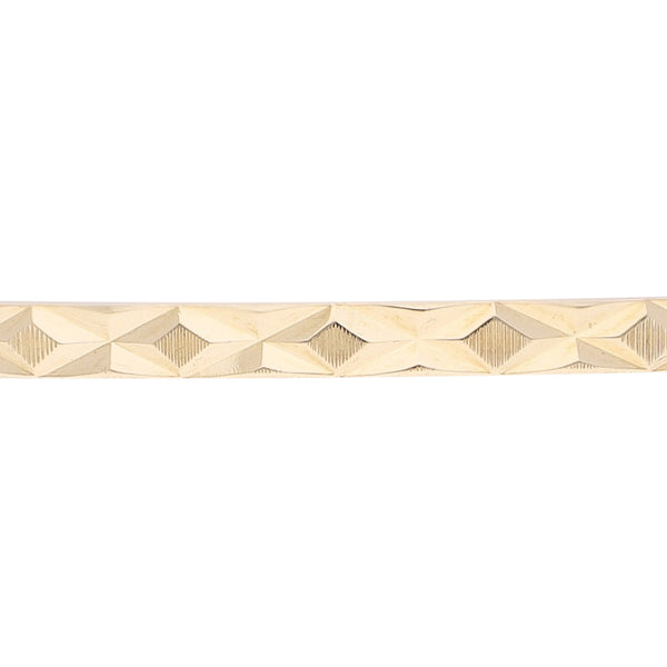 Pulsera de arillo infantil facetada en oro amarillo 14 kilates.