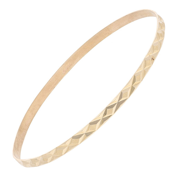 Pulsera de arillo infantil facetada en oro amarillo 14 kilates.