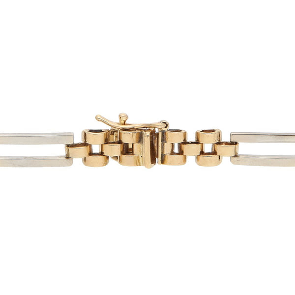 Pulsera eslabón articulado con sintéticos en oro dos tonos 14 kilates.