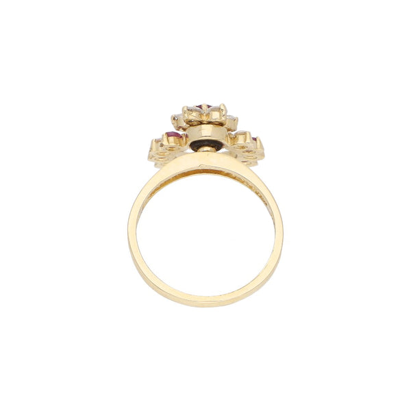 Anillo giratorio con rubíes y sintéticos en oro amarillo 14 kilates.