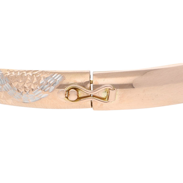 Pulsera de arillo labrada en oro rosa 14 kilates.