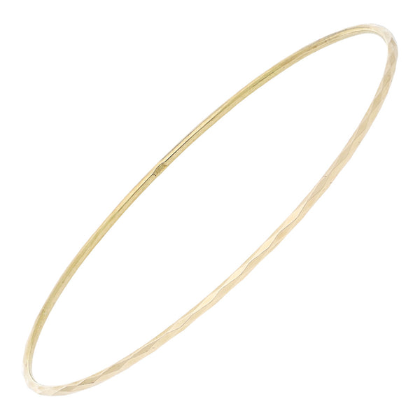 Pulsera de arillo facetada en oro amarillo 14 kilates.