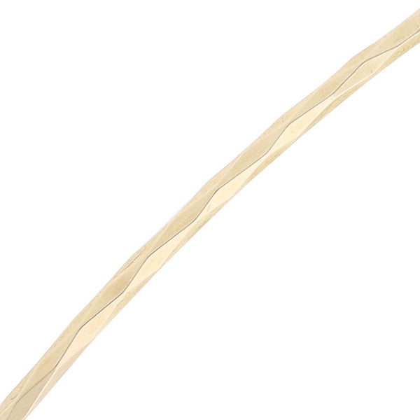 Pulsera de arillo facetada en oro amarillo 14 kilates.
