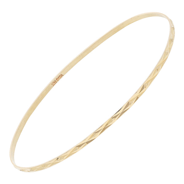 Pulsera de arillo facetada en oro amarillo 14 kilates.
