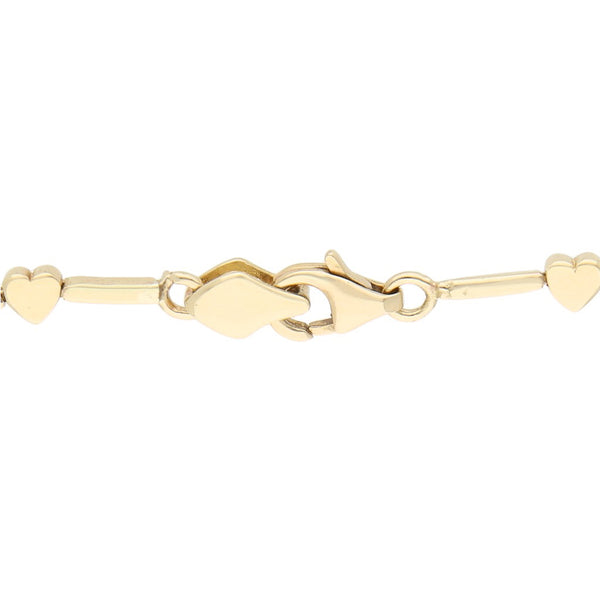 Pulsera eslabón articulado aplicaciones motivo corazón y sintéticos en oro amarillo 14 kilates.