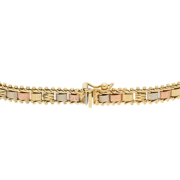 Pulsera eslabón boleado en oro tres tonos 14 kilates.