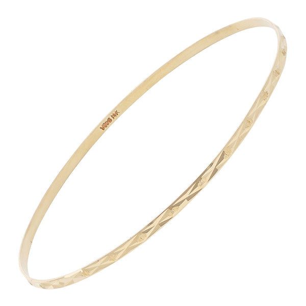 Pulsera de arillo facetada en oro amarillo 14 kilates.