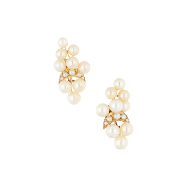 Aretes diseño especial con perlas en oro amarillo 14 kilates.