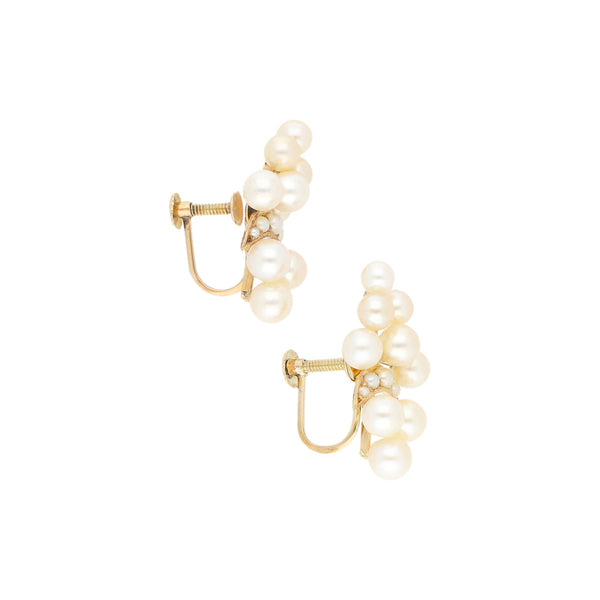 Aretes diseño especial con perlas en oro amarillo 14 kilates.