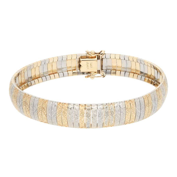 Pulsera eslabón articulado en oro dos tonos 14 kilates.