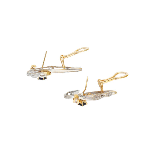 Juego de dije y aretes estilizados con sintéticos en oro dos tonos 14 kilates.