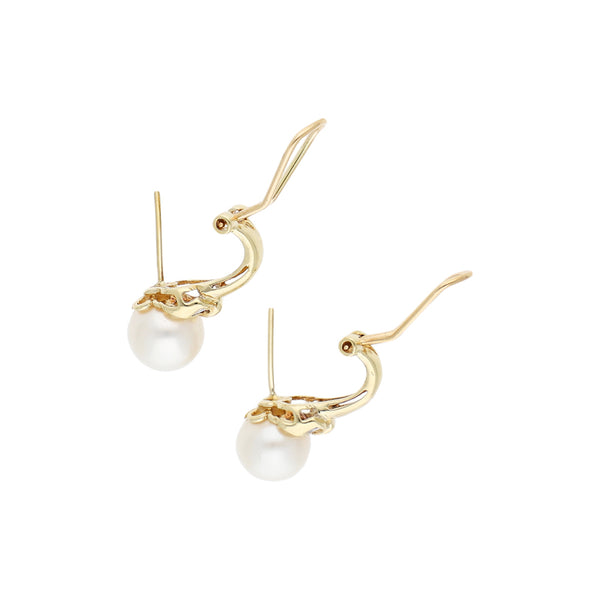 Juego de anillo y aretes diseño especial con diamantes y perlas en oro amarillo 14 kilates.