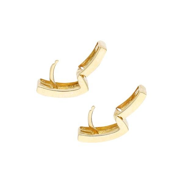 Juego de anillo, aretes y dije estilizado con sintéticos en oro amarillo 14 kilates.