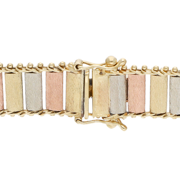 Pulsera eslabón boleado en oro tres tonos 14 kilates.