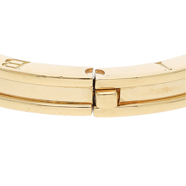 Pulsera de arillo articulada firma Bvlgari en oro amarillo 18 kilates.