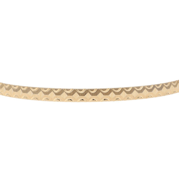 Pulsera de arillo facetada en oro amarillo 14 kilates.