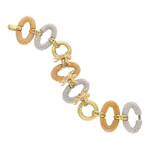 Pulsera eslabón combinado con aplicaciones motivo ángeles en oro tres tonos 14 kilates.