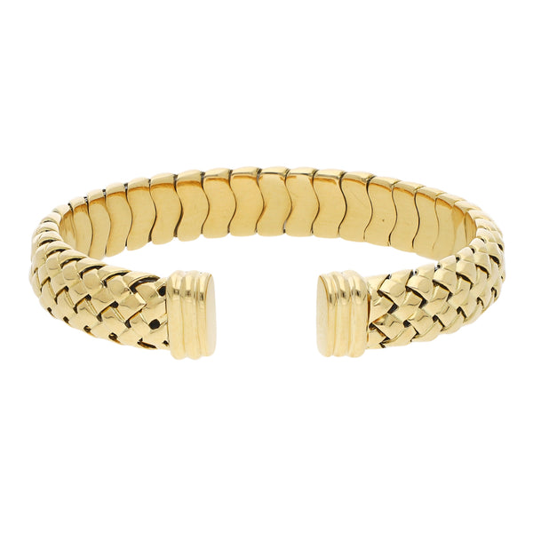 Pulsera de arillo tejida firma Tiffany & Co. en oro amarillo 18 kilates.