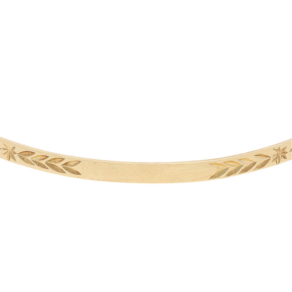 Pulsera de arillo labrada en oro amarillo 12 kilates.