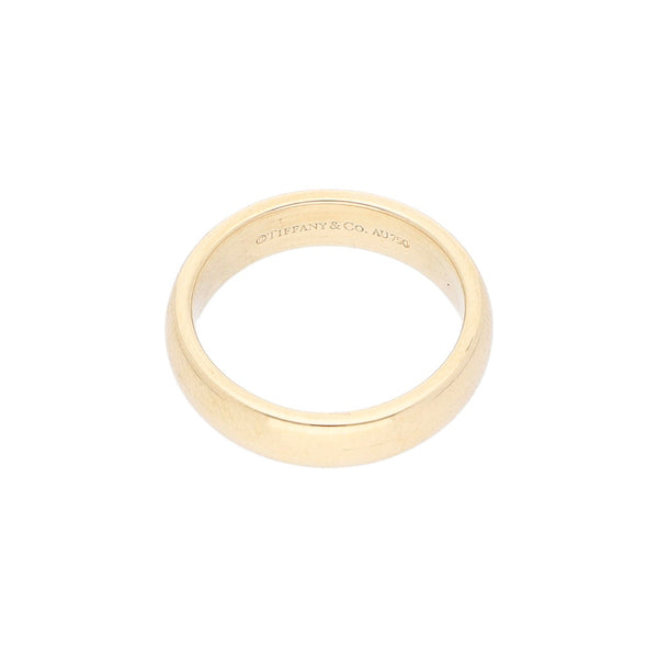 Argolla lisa firma Tiffany & Co. en oro amarillo 18 kilates.