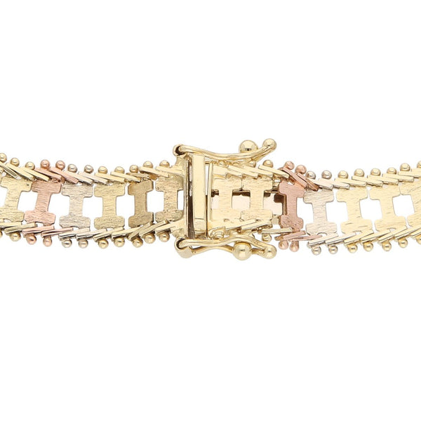 Pulsera eslabón boleado en oro tres tonos 14 kilates.