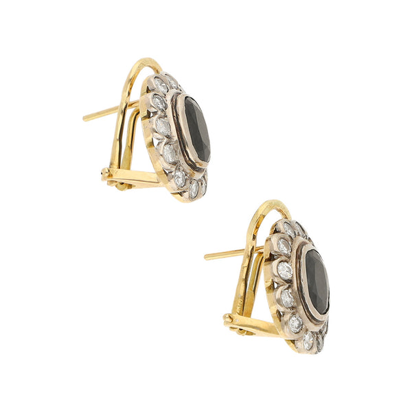 Aretes diseño especial con diamantes y ónix en oro amarillo 14 kilates.