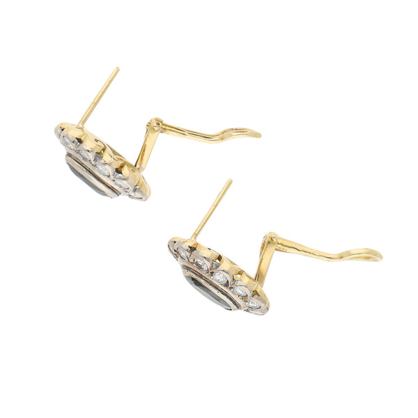 Aretes diseño especial con diamantes y ónix en oro amarillo 14 kilates.