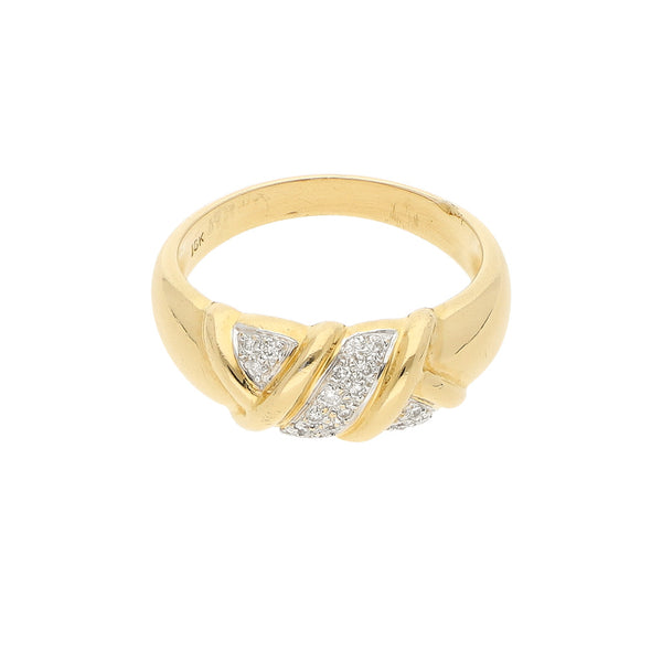 Anillo diseño estilizado con diamantes en oro amarillo 18 kilates.