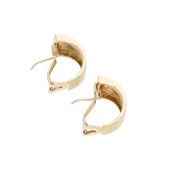 Aretes estilizados en oro amarillo 14 kilates.
