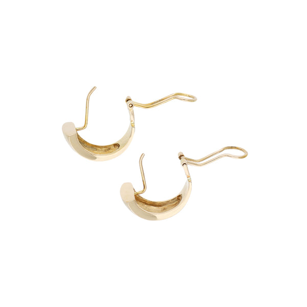 Aretes estilizados en oro amarillo 14 kilates.