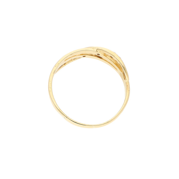 Anillo estilizado motivo infinito con sintéticos en oro amarillo 14 kilates.