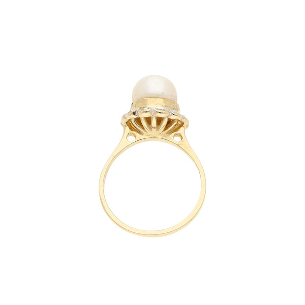 Anillo diseño especial con perla y sintéticos en oro amarillo 14 kilates.