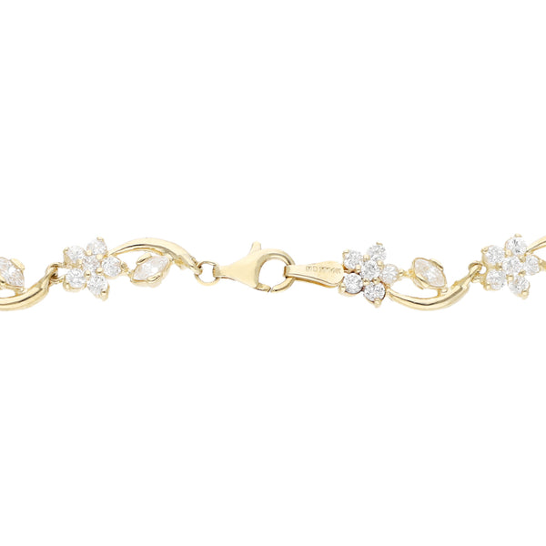 Pulsera eslabón encontrado con sintéticos motivo flor en oro amarillo 14 kilates.