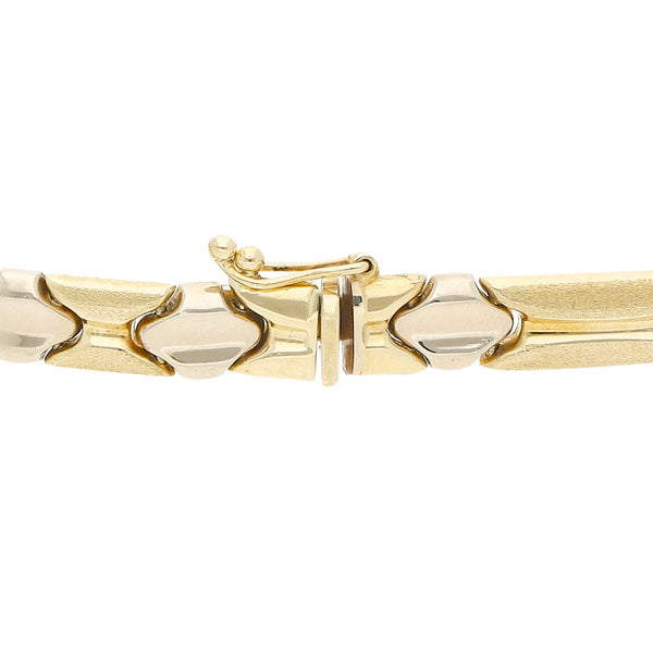 Pulsera eslabón articulado en oro dos tonos 14 kilates.