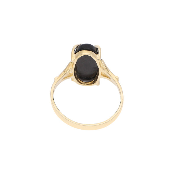 Anillo diseño especial con sintéticos y aplicación motivo flor en oro amarillo 14 kilates.