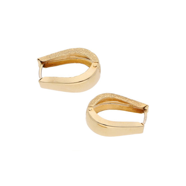 Arracadas articuladas en oro amarillo 14 kilates.