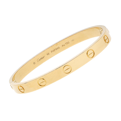 Pulsera de arillo articulada firma Cartier en oro amarillo 18 kilates.