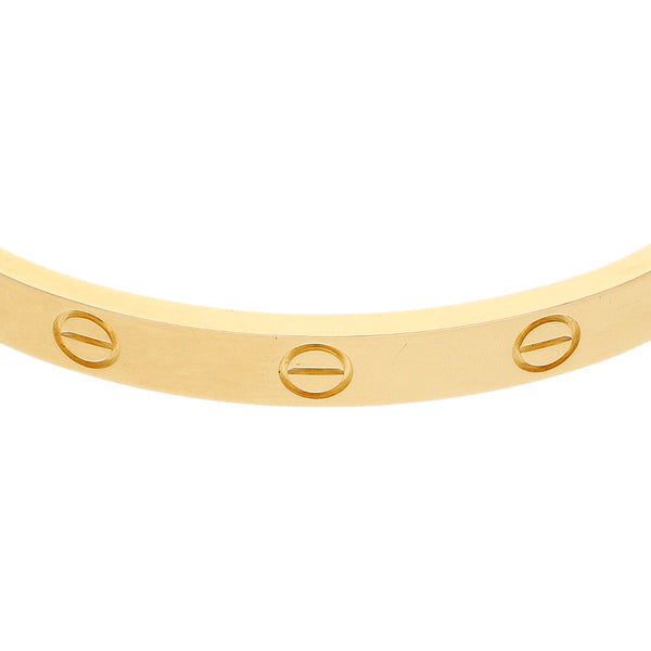 Pulsera de arillo articulada firma Cartier en oro amarillo 18 kilates.
