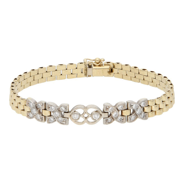 Pulsera eslabón articulado con aplicaciones y sintéticos en oro amarillo 14 kilates.
