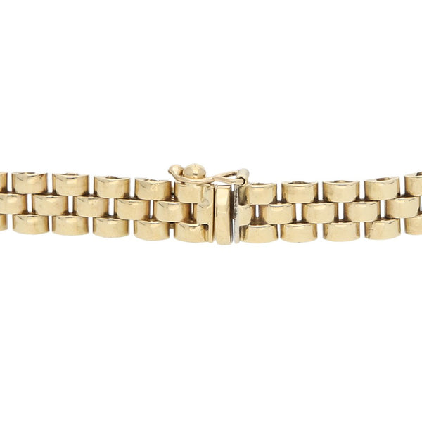 Pulsera eslabón articulado con aplicaciones y sintéticos en oro amarillo 14 kilates.