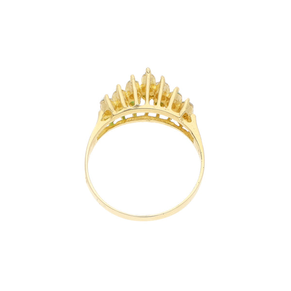 Anillo diseño especial con sintéticos en oro amarillo 12 kilates.