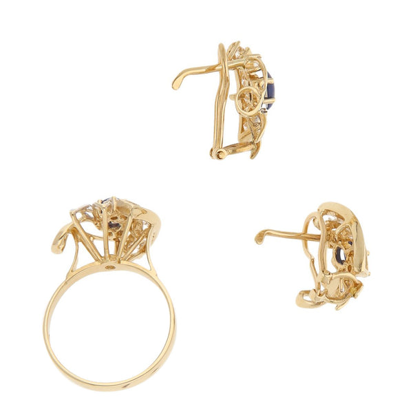 Juego de anillo y aretes calados con sintéticos en oro amarillo 14 kilates.