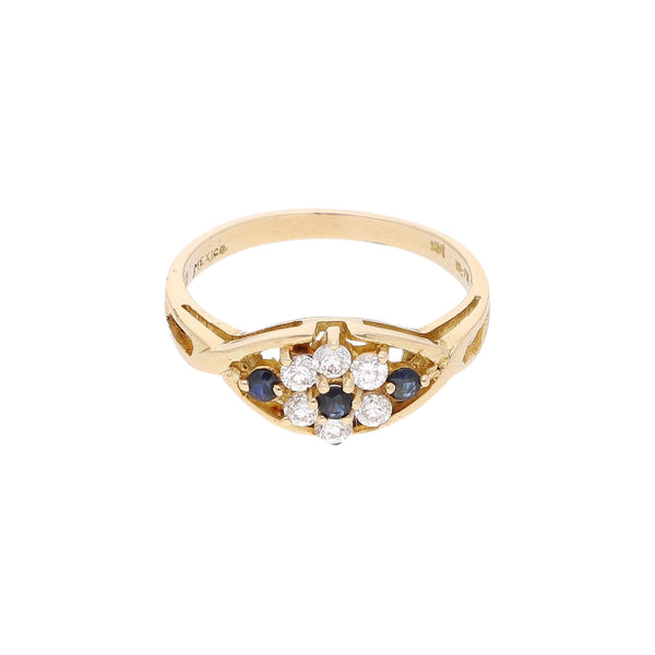 Anillo diseño especial motivo flor con sintéticos en oro amarillo 14 kilates.