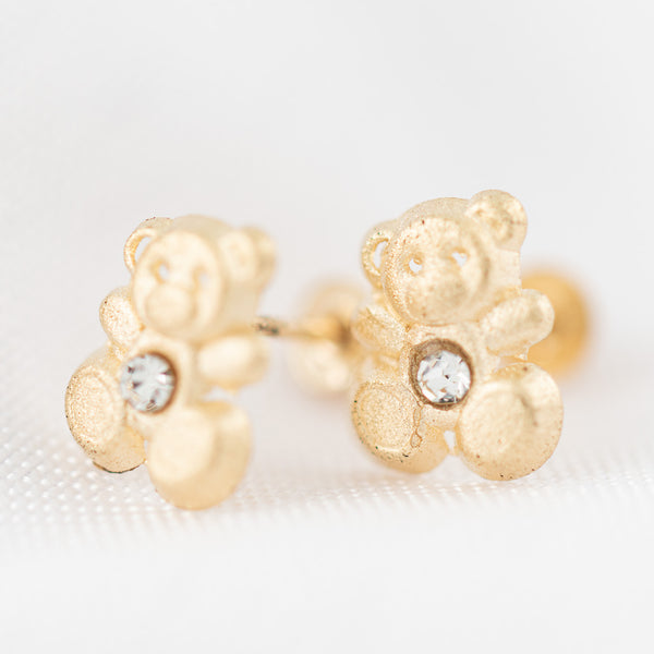 Tres pares de broqueles diseño especial dos con sintéticos en oro amarillo 14 kilates.