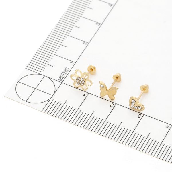 Tres pares de broqueles diseño especial con sintéticos en oro amarillo 14 kilates.