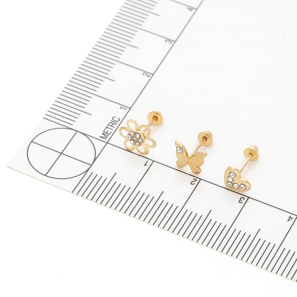 Tres pares de broqueles diseño especial con sintéticos en oro amarillo 14 kilates.