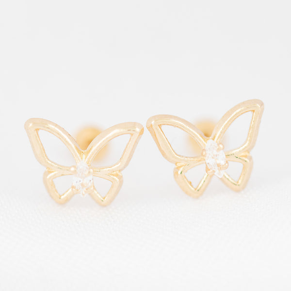 Tres pares de broqueles diseño especial con sintéticos en oro amarillo 14 kilates.