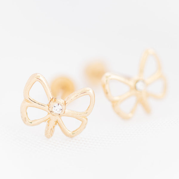 Tres pares de broqueles diseño especial dos con sintéticos en oro amarillo 14 kilates.