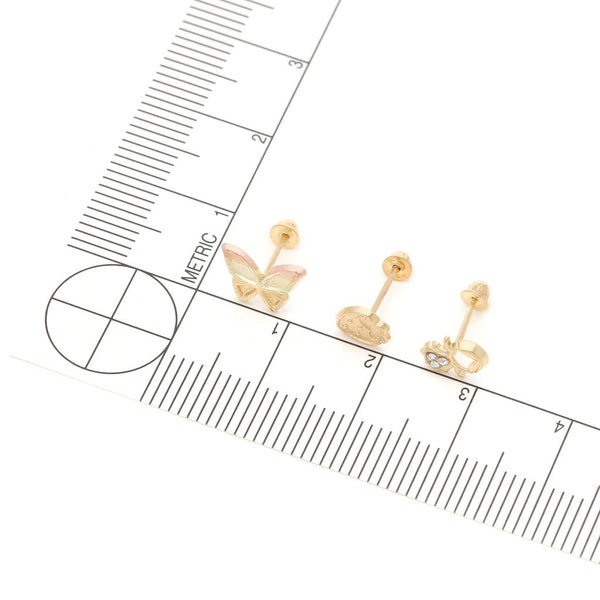 Tres pares de broqueles diseño especial uno con sintéticos en oro tres tonos 14 kilates.