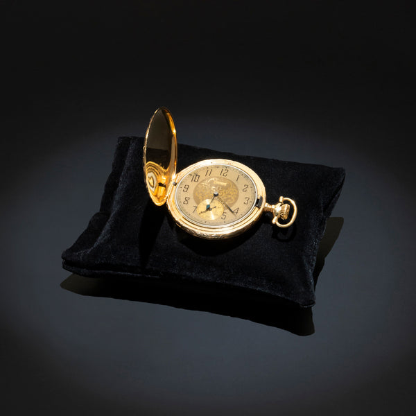 Reloj Elgin de bolsillo en acero chapa y oro amarillo 18 kilates.